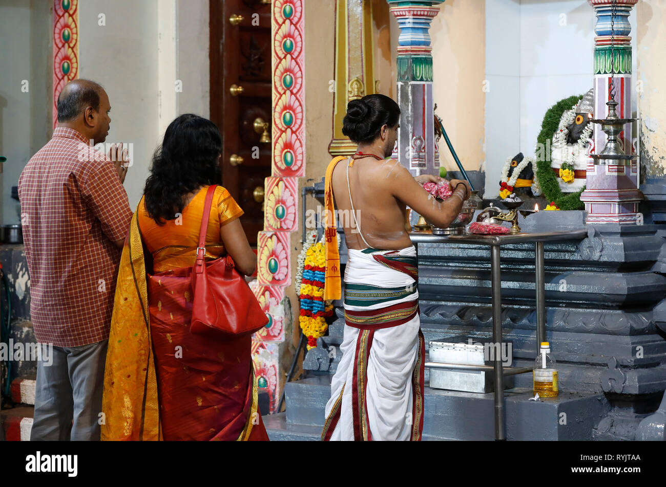 Puja. Traditional Hindu Ceremony.  Sri Mariamman Hindu temple.  Singapore. Stock Photo