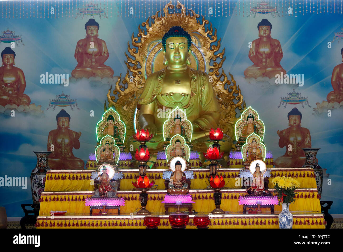 Huynh Dao buddhist pagoda.  Buddha statues on main altar.  Chau Doc. Vietnam. Stock Photo