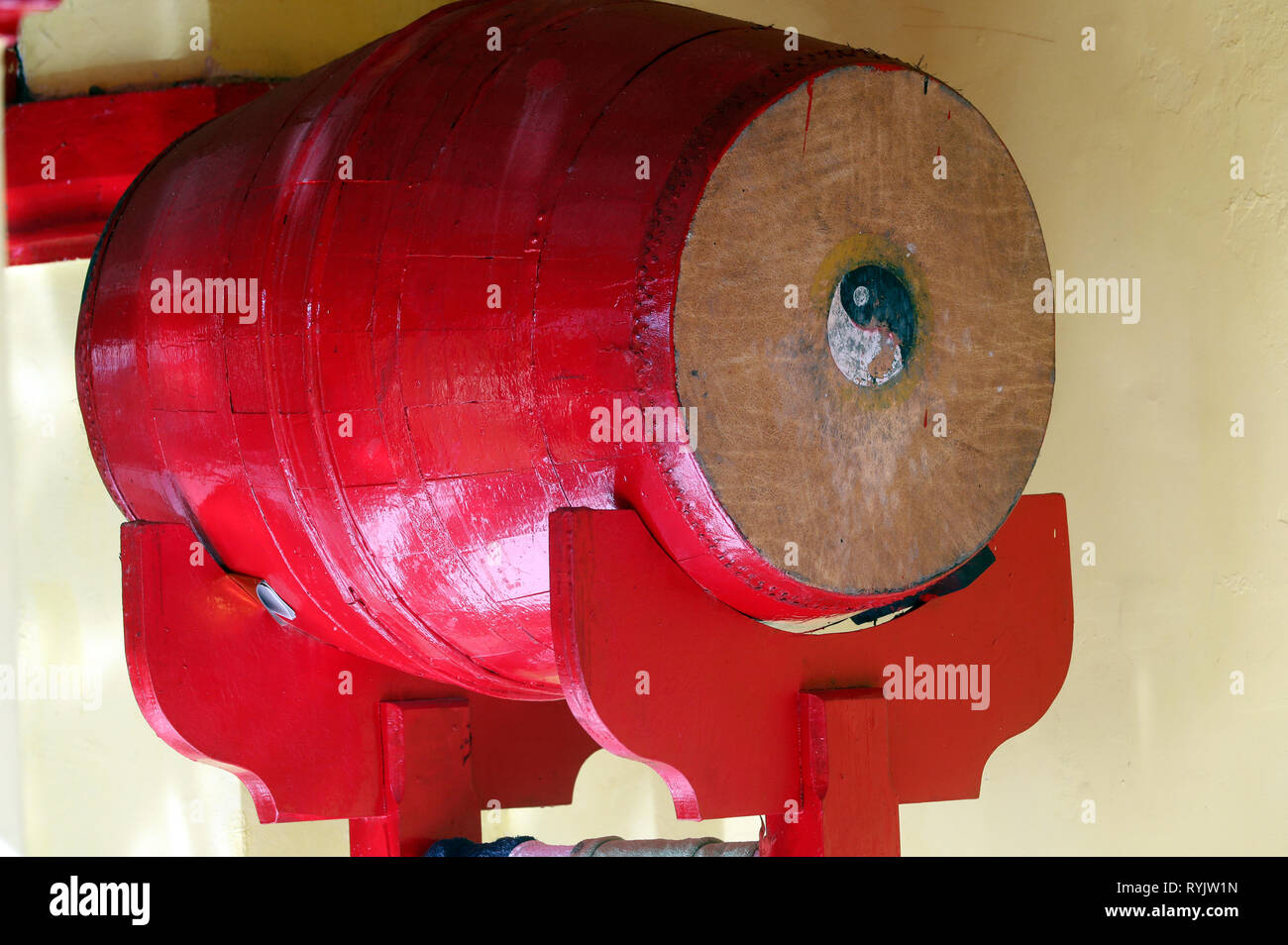 Red buddhist drum with Ying and Yang symbols.  Ong Bon buddhist temple. Ha Tien. Vietnam. Stock Photo