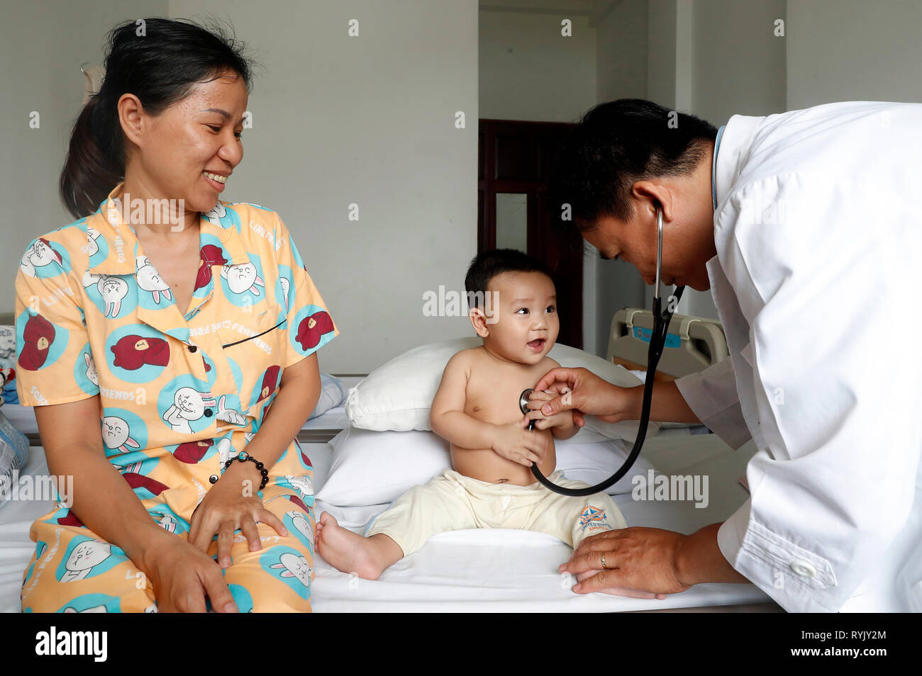 Tam Duc Cardiology Hospital. Pediatric ward.  Child suffering of heart disease. Medical consultation.  Ho Chi Minh City. Vietnam. Stock Photo