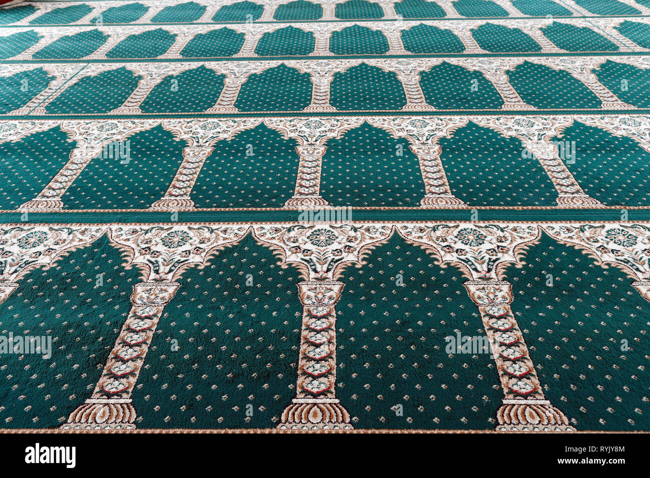 Masjid Al Ehsan mosque.  Prayer hall with green carpet.  Chau Doc. Vietnam. Stock Photo