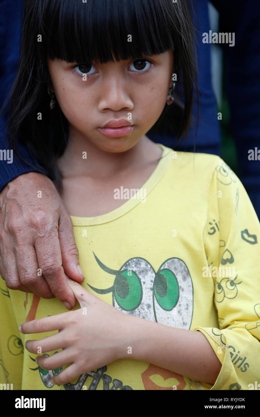 Free health clinic run by the Franciscan Missionaries of Mary. Ethnic minority child with mother. Dalat. Vietnam. Stock Photo