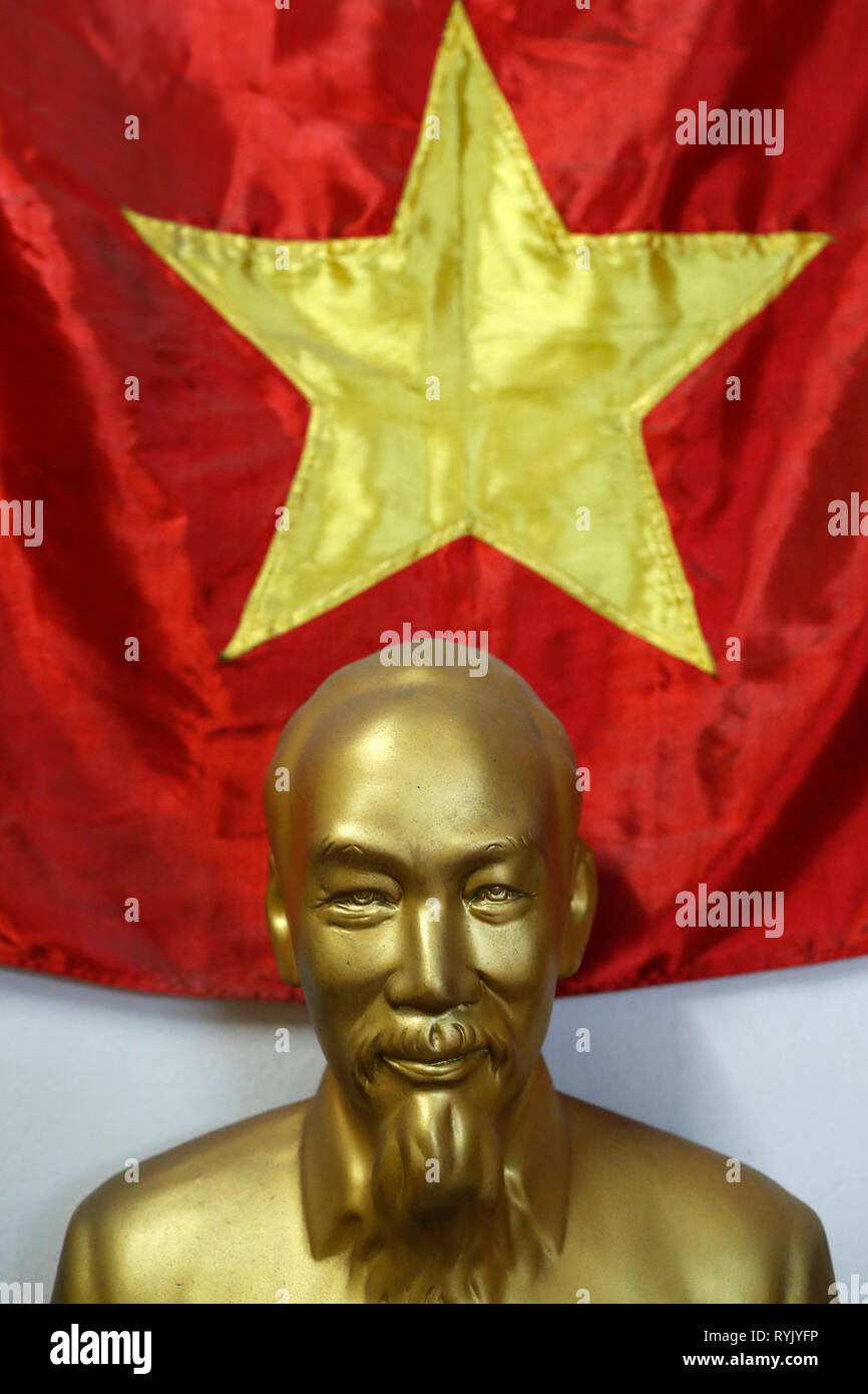 Statue of leader Ho Chi Minh and communist vietnamese flag.  Ho Chi Minh City. Vietnam. Stock Photo