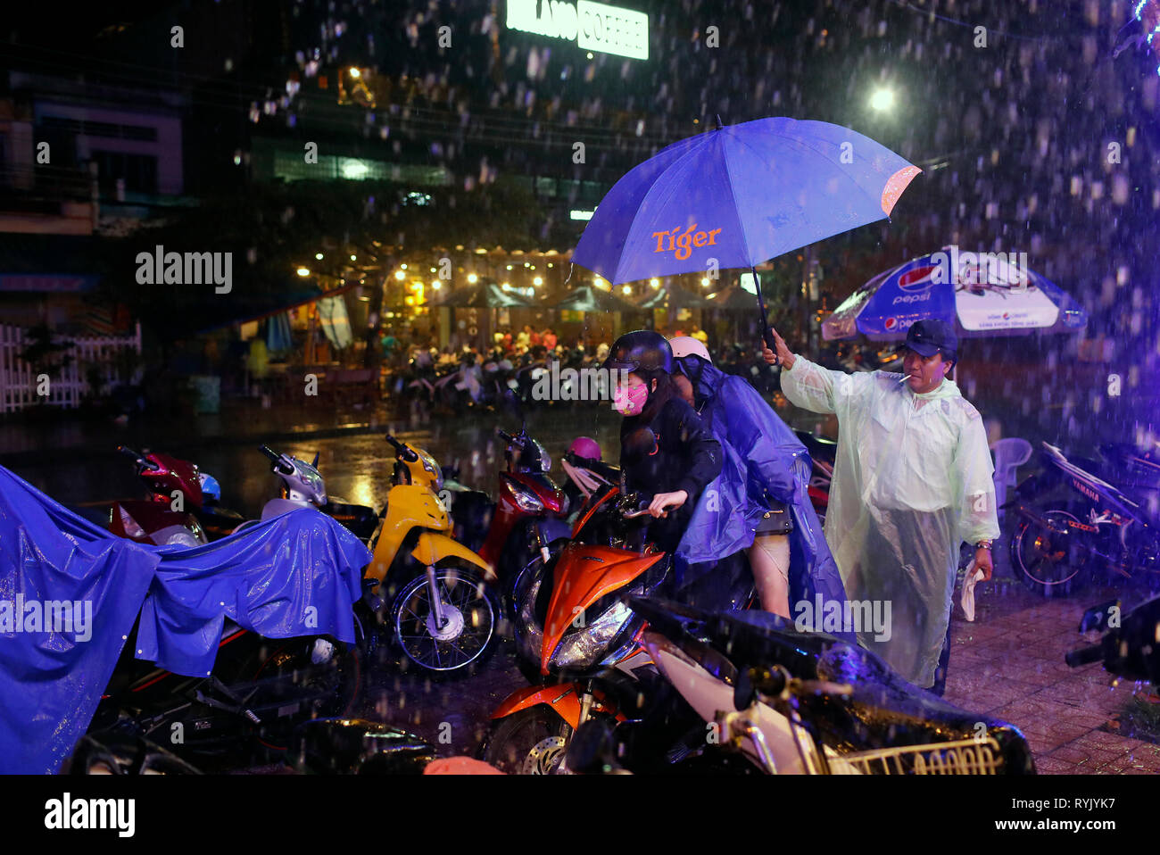 Rainy season. Motorbikes parking. Chau Doc. Vietnam. Stock Photo