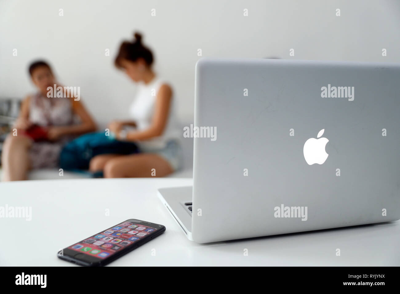 Laptop on a table. Mac Book.  Ho Chi Minh City. Vietnam. Stock Photo