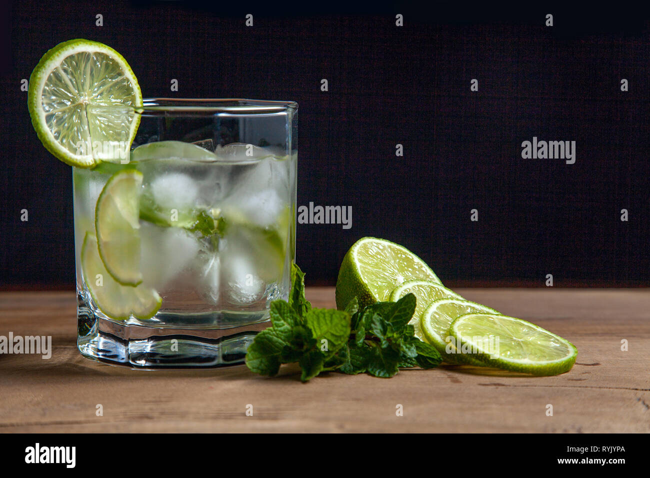 Mojito summer beach refreshing tropical cocktail in glass soda water, lime juice, mint leaves