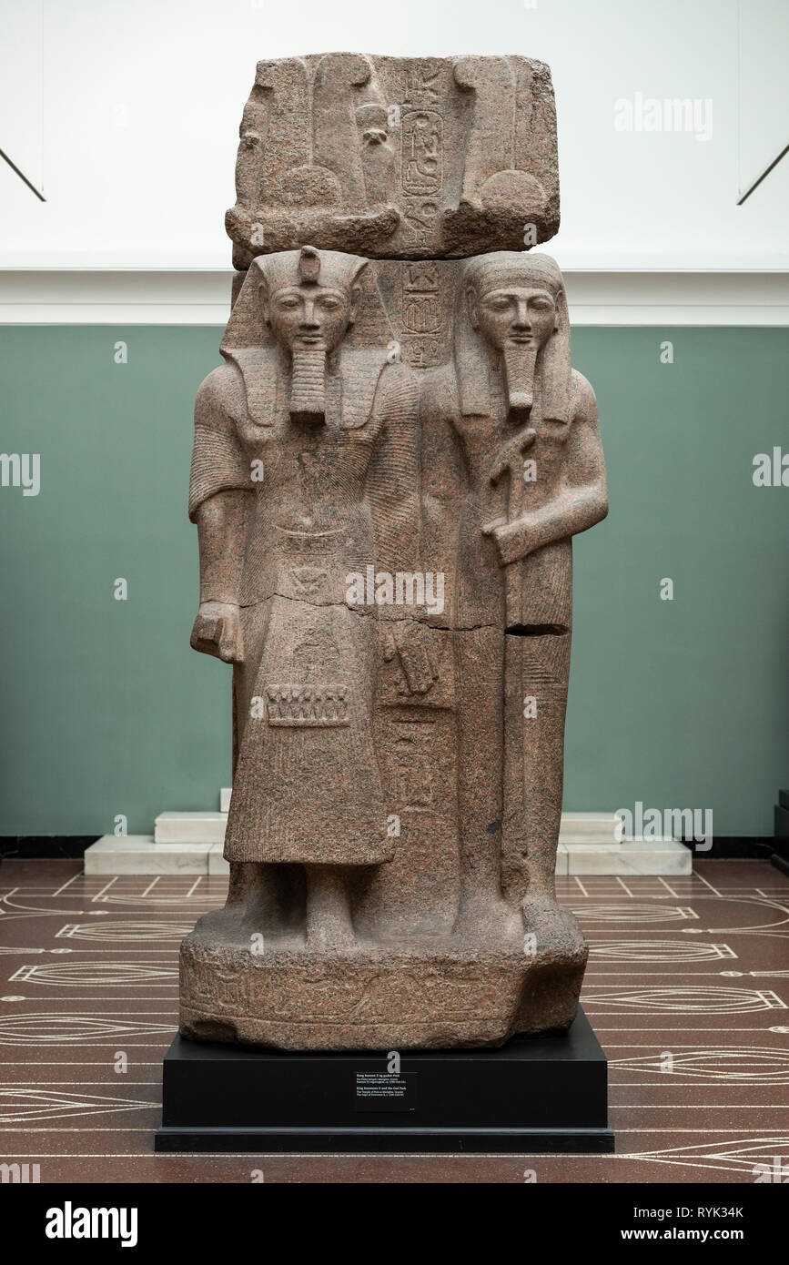 Copenhagen. Denmark. Statue of the Egyptian Pharaoh Ramesses II (left) and the God Ptah-Tatenen (right). Ny Carlsberg Glyptotek.  Reign of Ramesses II Stock Photo