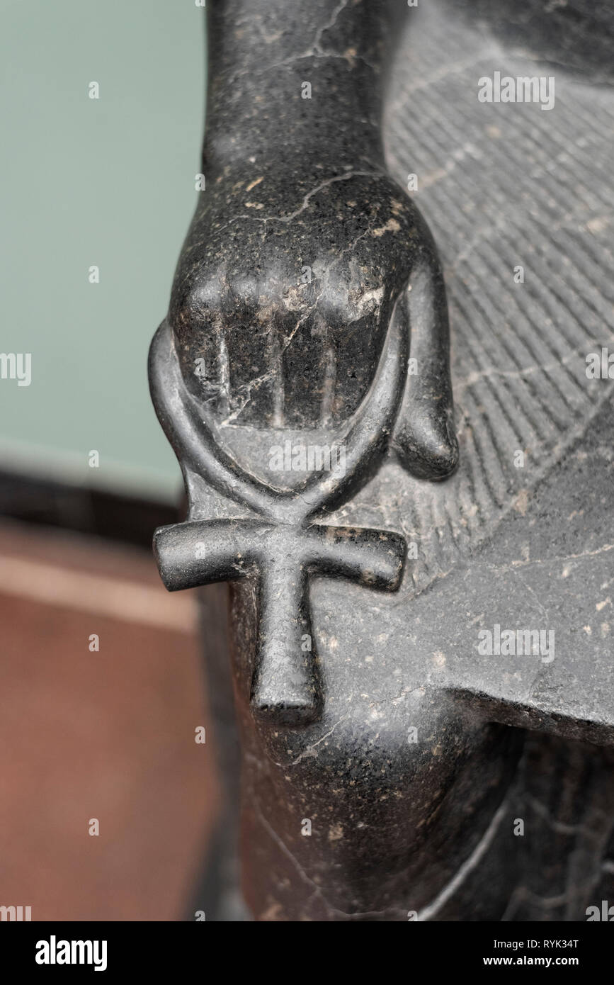 Copenhagen. Denmark. Detail of Anubis holding an ankh. Ny Carlsberg Glyptotek.  The ankh is an ancient Egyptian hieroglyphic symbol that was most comm Stock Photo