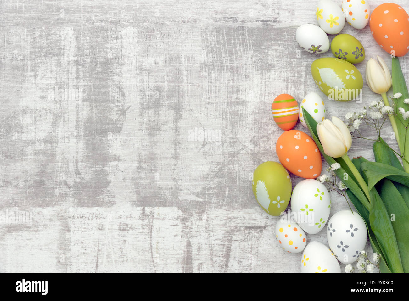Easter eggs and spring flowers background. Top view with copy space ...