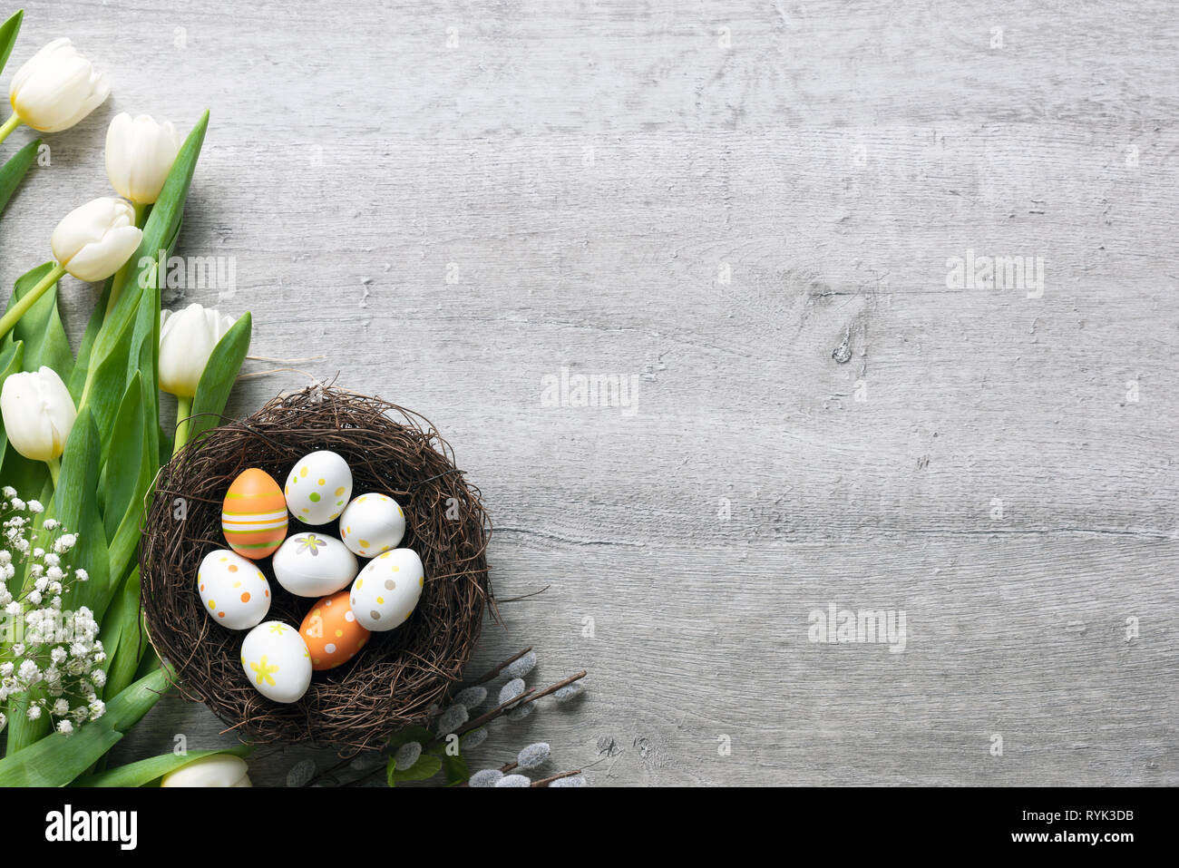 Easter eggs and spring flowers background. Top view with copy space ...