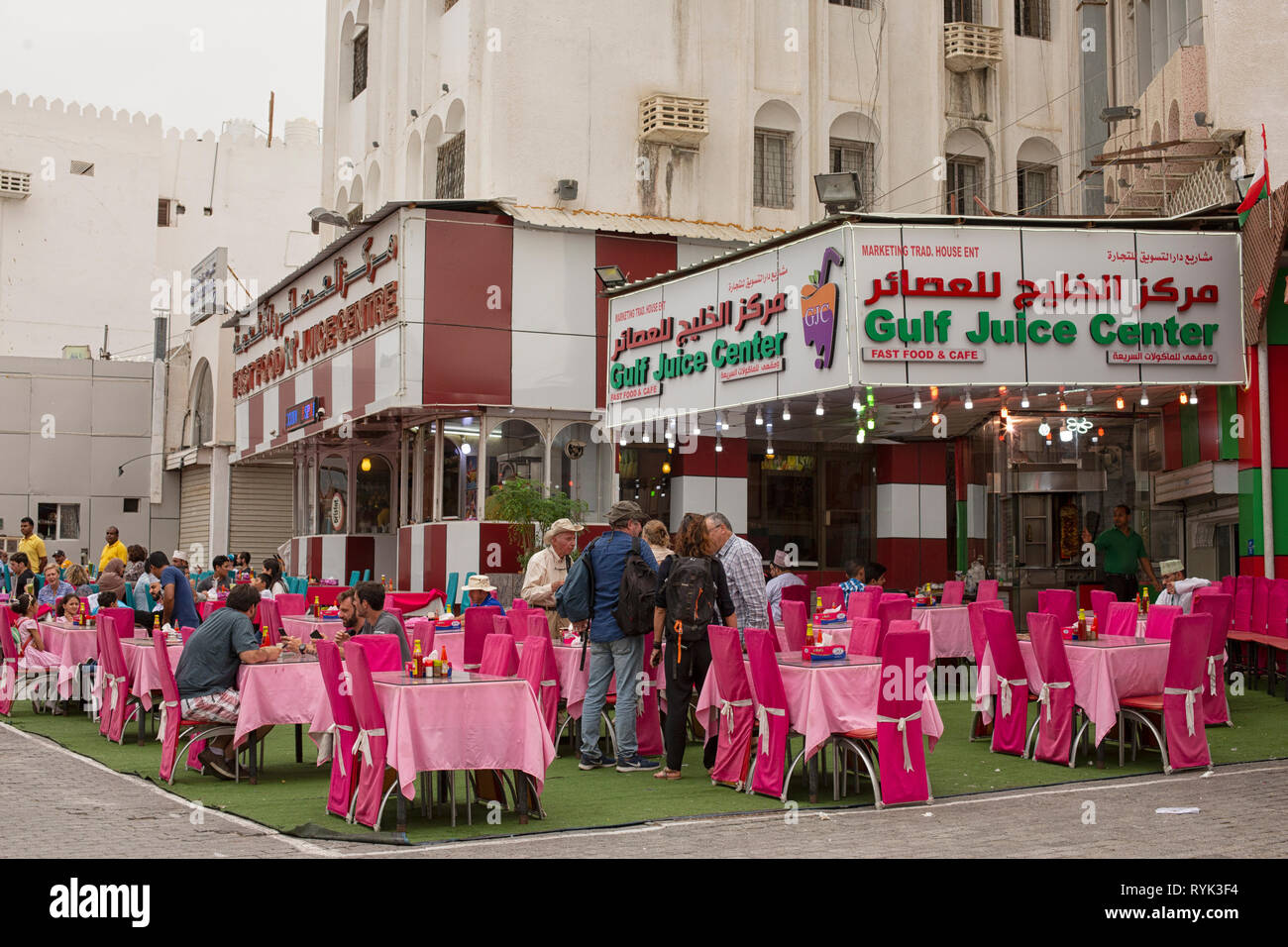Gulf juice center with terrace and tourists near the Souq in Muscat, Oman Stock Photo