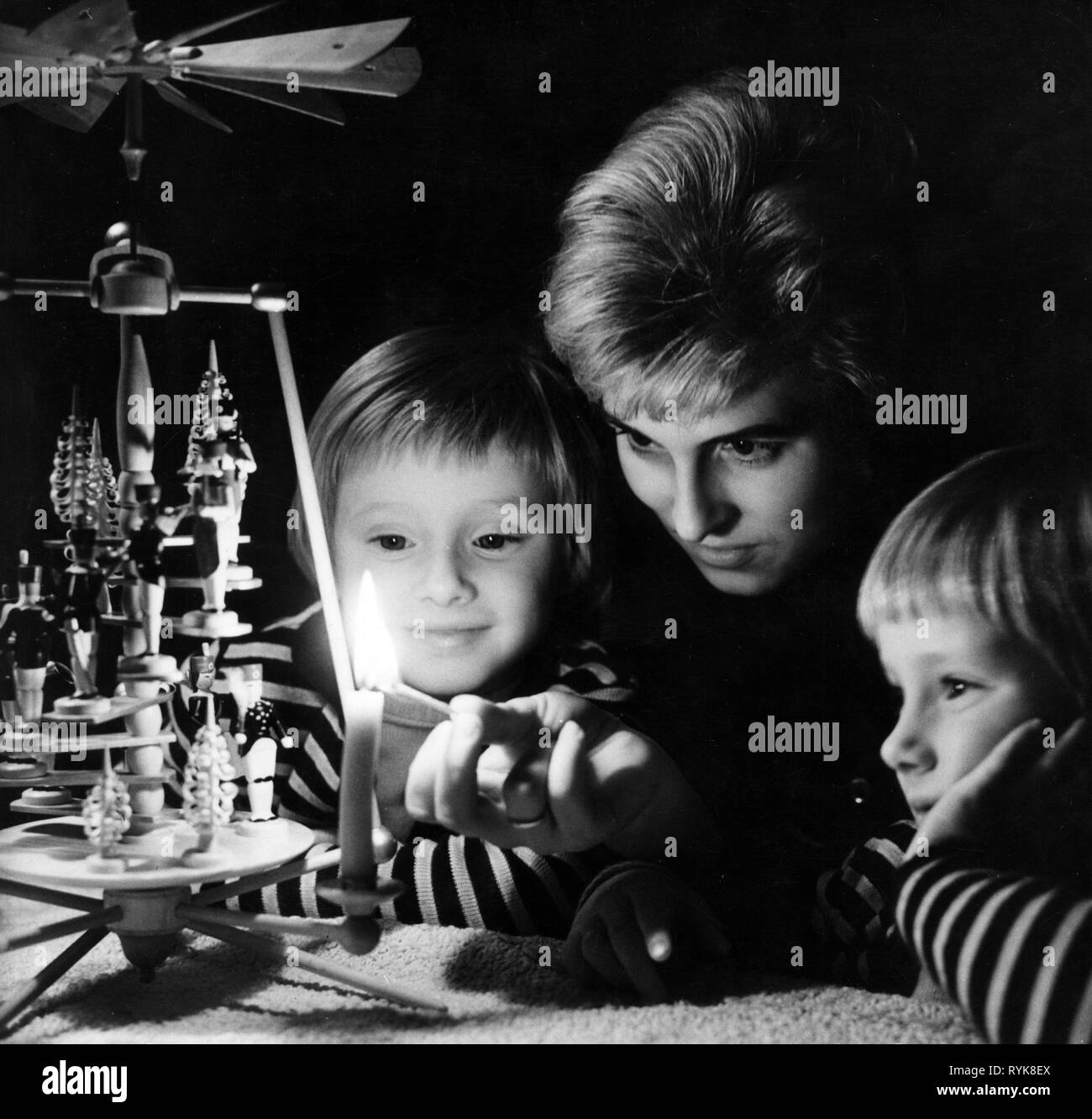 Christmas, people, mother with children lighting a candle at Christmas pyramid, 4.12.1961, Additional-Rights-Clearance-Info-Not-Available Stock Photo