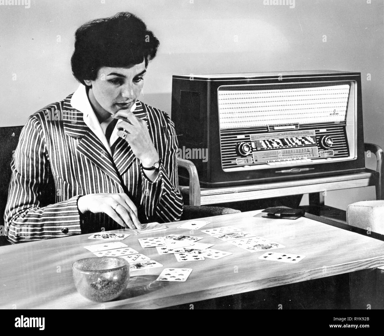 broadcast, radio, radio sets, Siemens Meistersuper D8, a young woman is  playing patience and listening to the radio, Germany, 1958,  Additional-Rights-Clearance-Info-Not-Available Stock Photo - Alamy