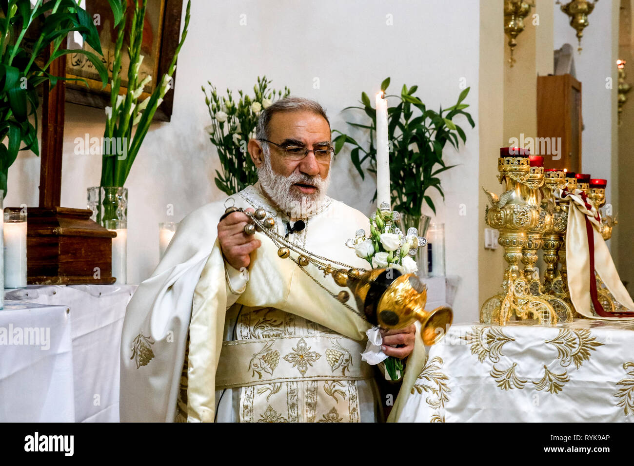 Father Emile Shoufani celebrating the Myrrh bearers' sunday in the Nazareth melkite (Greek catholic) chuch, Galilee, Israel. Stock Photo