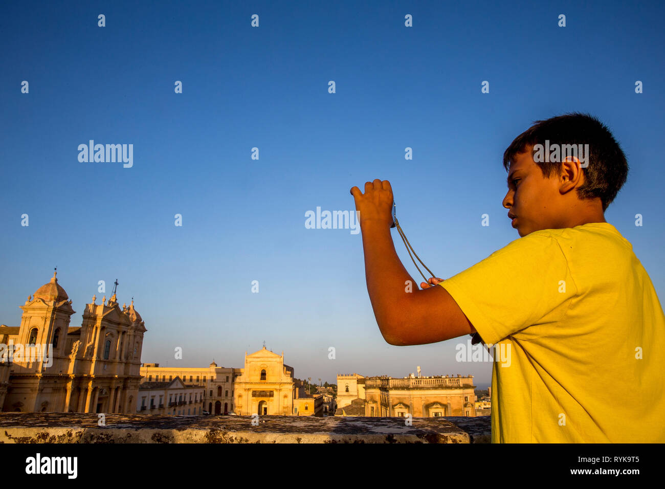 12-year-old boy visiting Noto, Sicily (Italy). Stock Photo