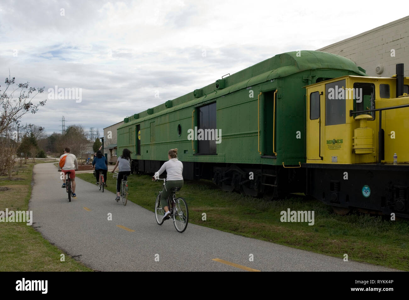 People ride bikes at Greenlink bike and hiking trail at Greenville