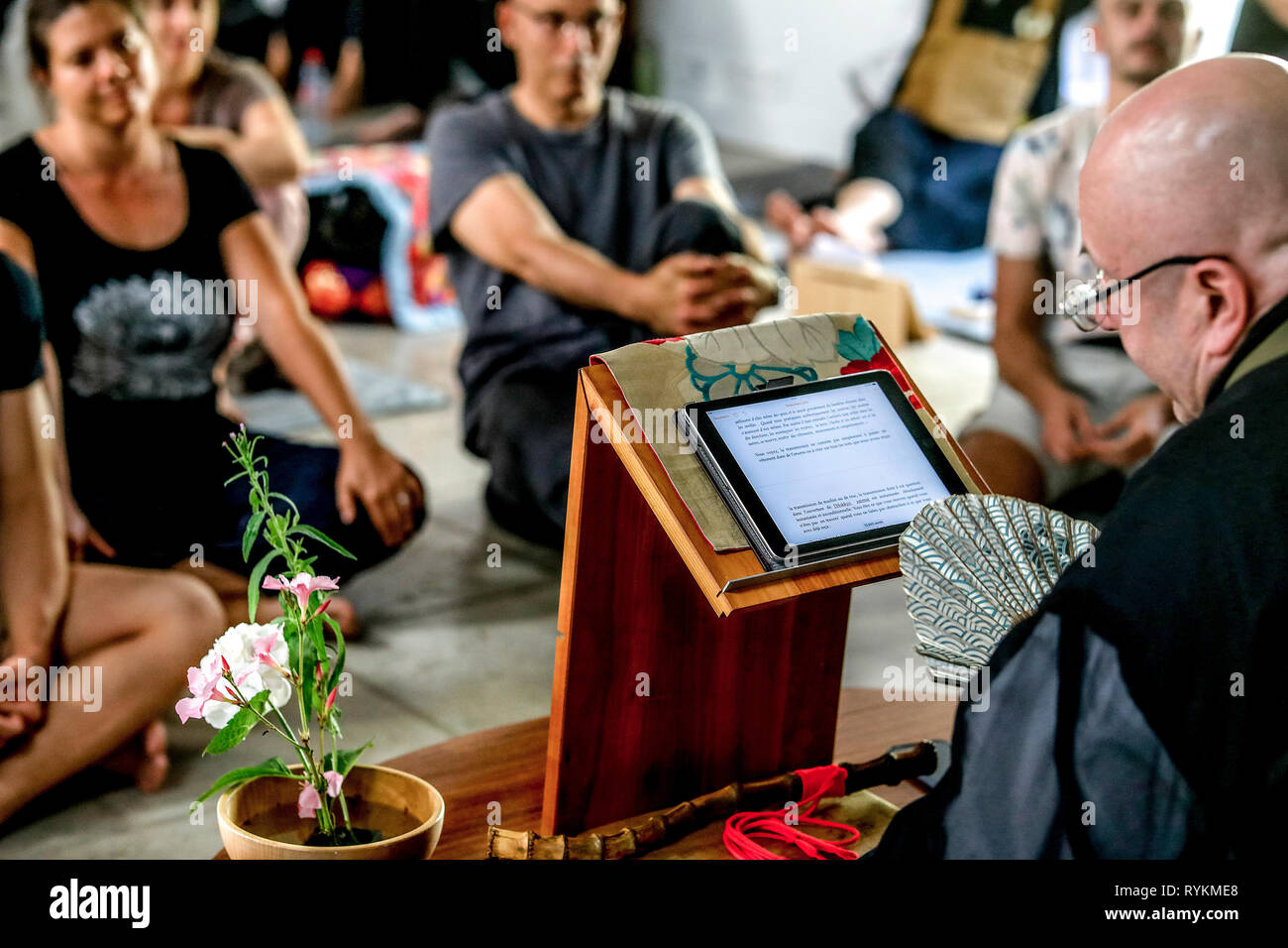 Zen sesshin (retreat) in Paris, France. Master giving a lecture. Stock Photo