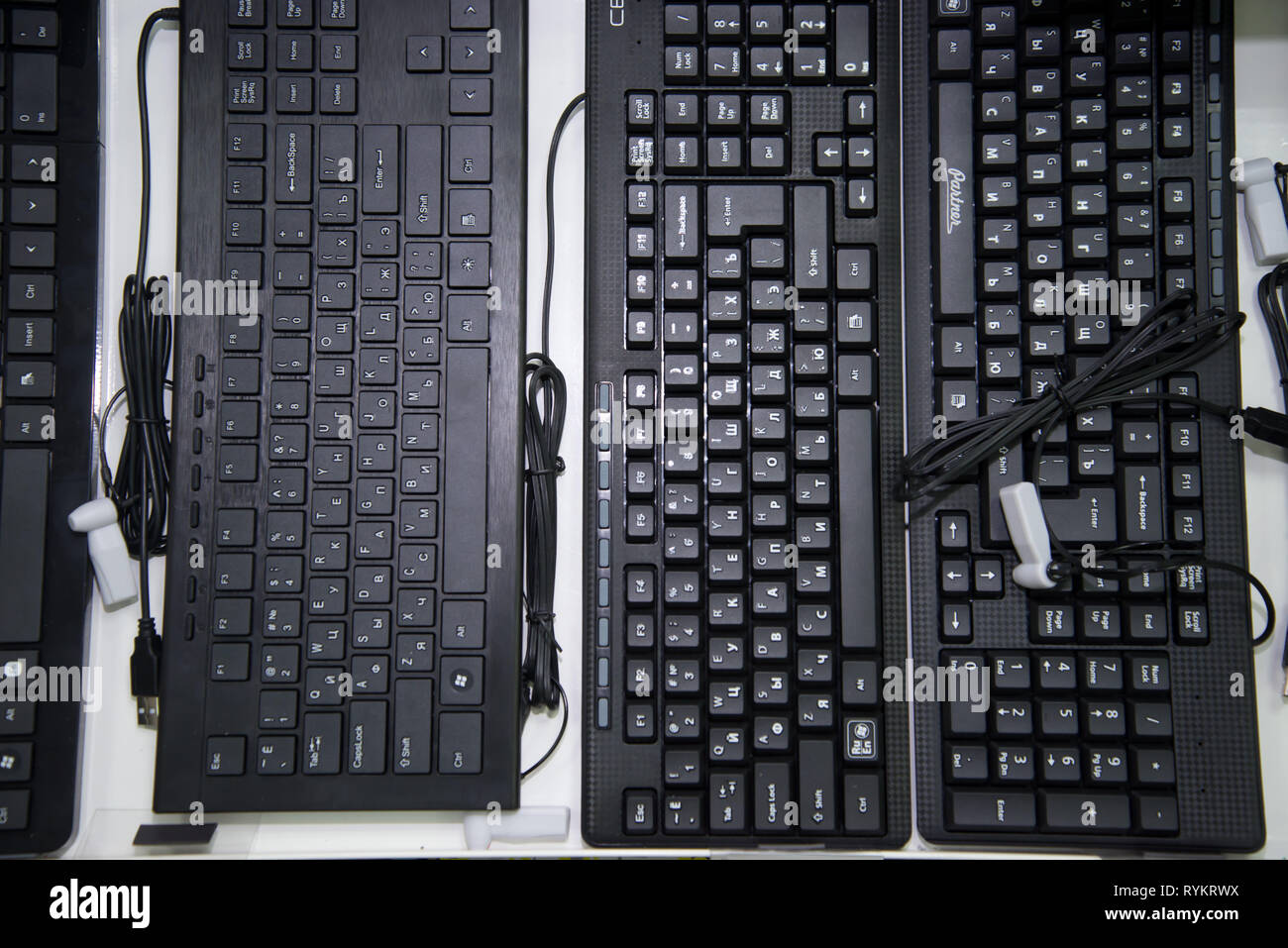 Chelyabinsk Region, Russia - February 2019. Black keyboard for a computer with a Russian font on the storefront. Stock Photo