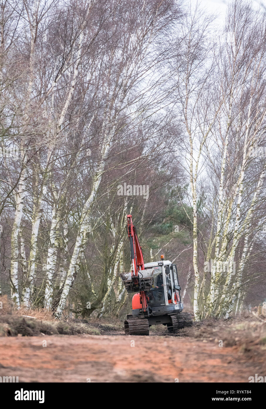 Kubota KX 161-3 mini excavator operating along a moorland track. Stock Photo
