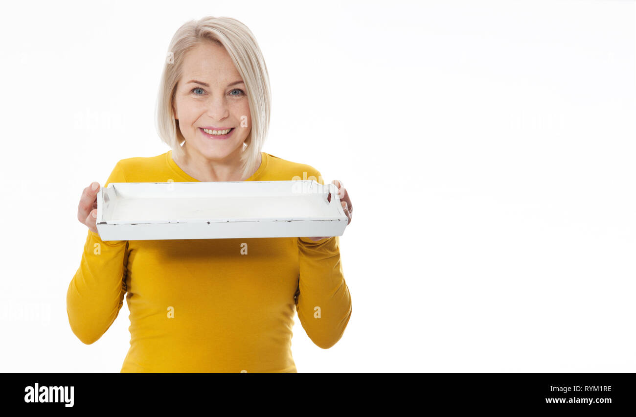 Kitchen woman waitress gives empty tray for your advertising products isolated on white background. Mock up for use Stock Photo