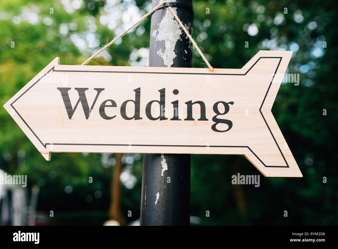 Weddings allowed UK England coronavirus 2020. hanging wooden sign with the word wedding written on it Stock Photo
