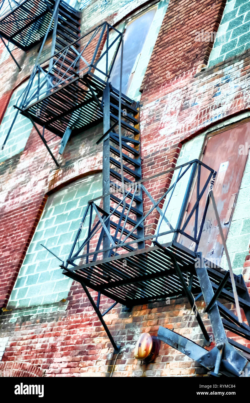 Fire escape ladders at the Carter Car Factory at Pontiac, MI, USA. This building was constructed in the early 20th century, and is now lying empty. Stock Photo