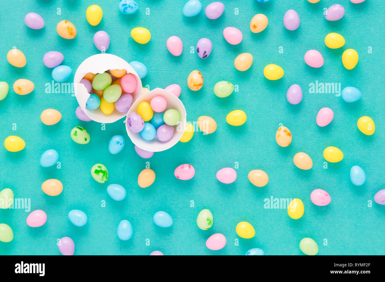 colorful easter egg candy on a teal background Stock Photo