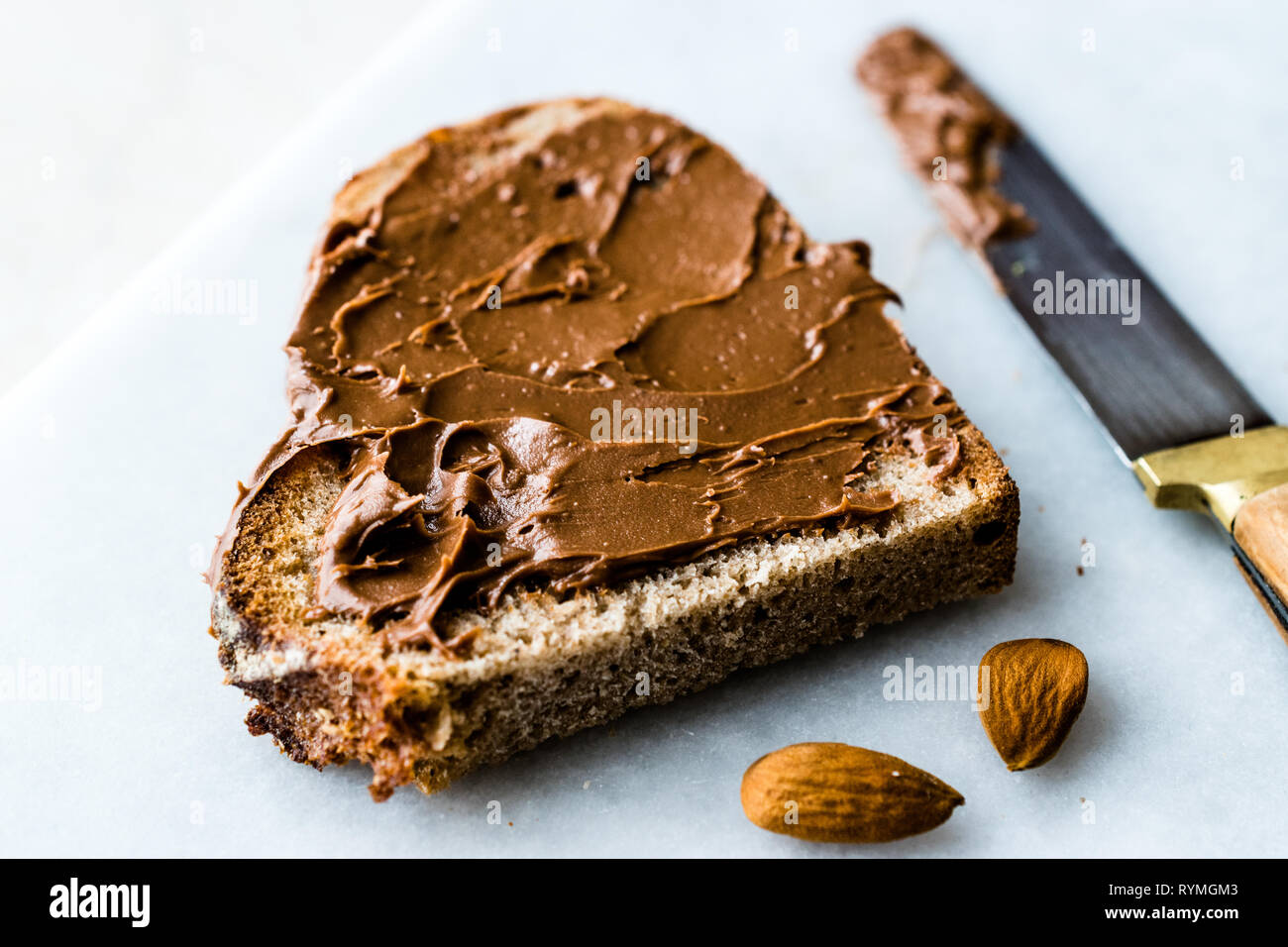 Raw Organic Almond Butter Cream with Bread for Breakfast Stock Photo