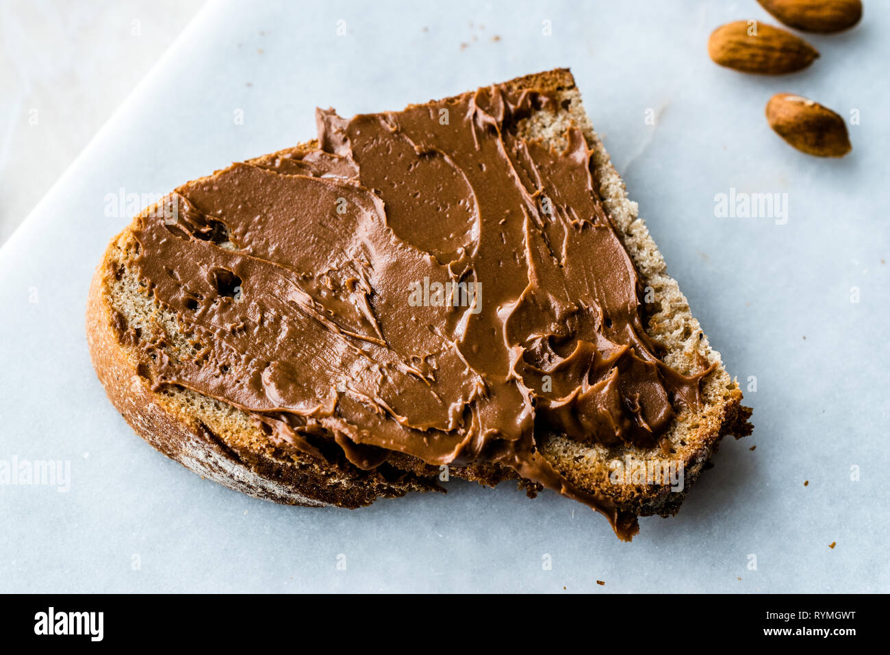 Raw Organic Almond Butter Cream with Bread for Breakfast Stock Photo