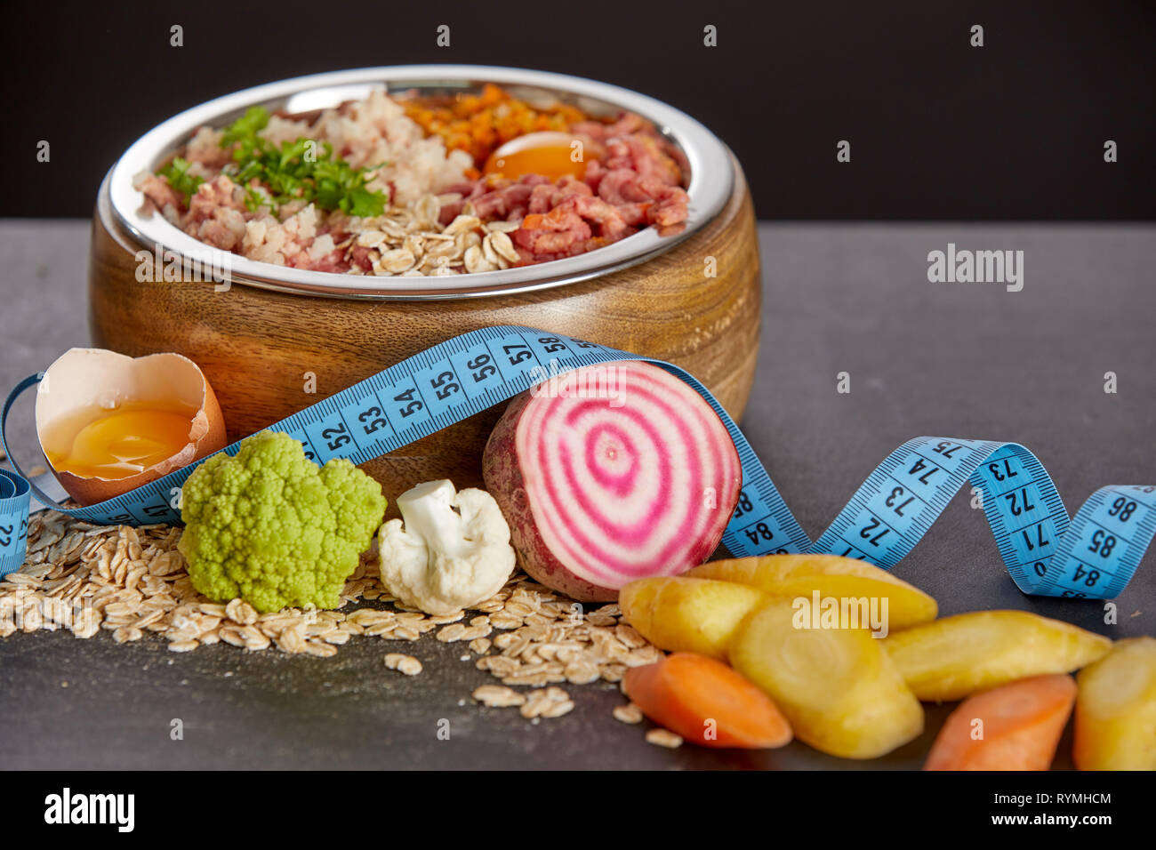 Bowl of mixed biologically appropriate raw food BARF of fresh vegetables meat cereals and eggs. Concept of alternative raw meal in modified homemade Stock Photo Alamy