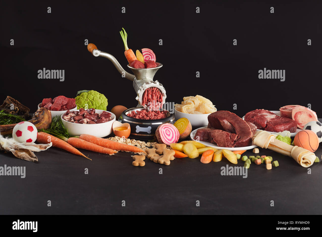 Colorful still life of fresh raw food for barf dog feed with assorted