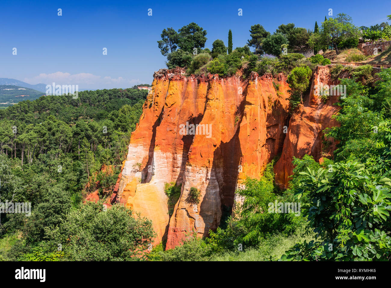 Beautiful red ocher cliffs near the village of Roussillon, France. Stock Photo