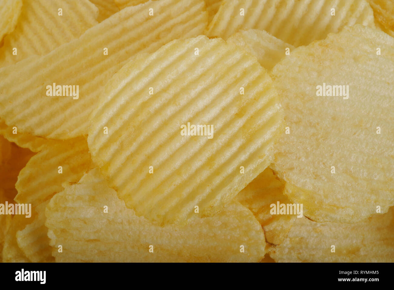 Potato chips background Stock Photo - Alamy