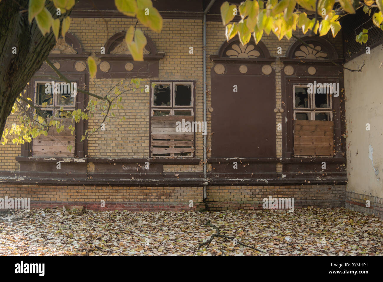 Old building in park at the fall time, rustic and falling apart from ...