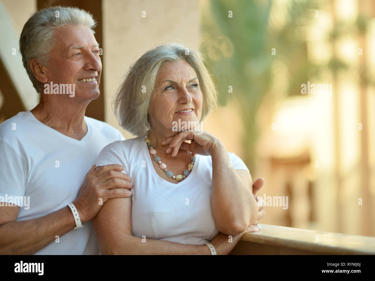 Portrait of cute senior couple relaxing near hotel resort Stock Photo ...