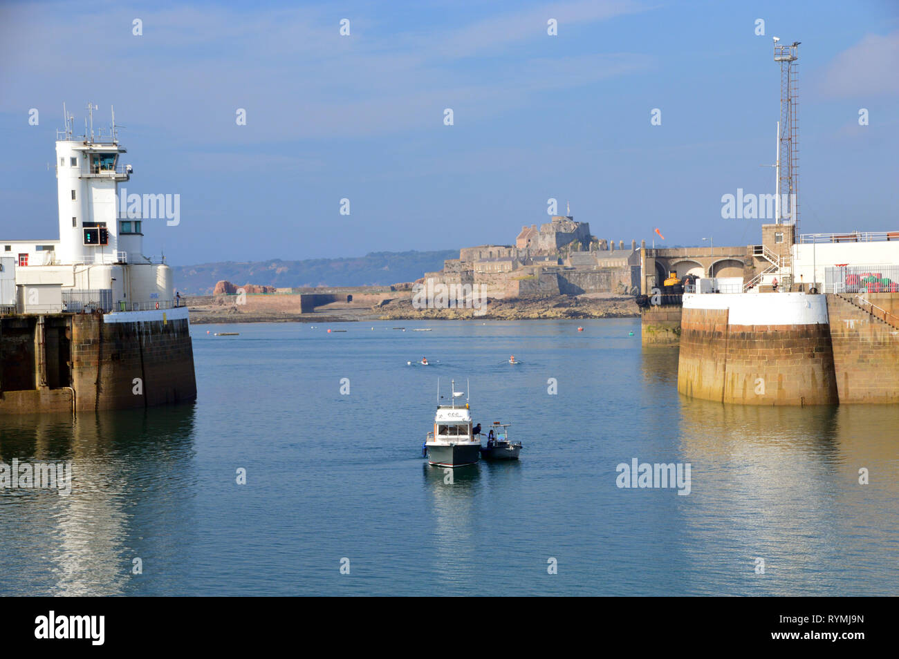 Fishing Boat Entering the Old Harbour in St Helier, Island of Jersey, Channel Isles, UK. Stock Photo
