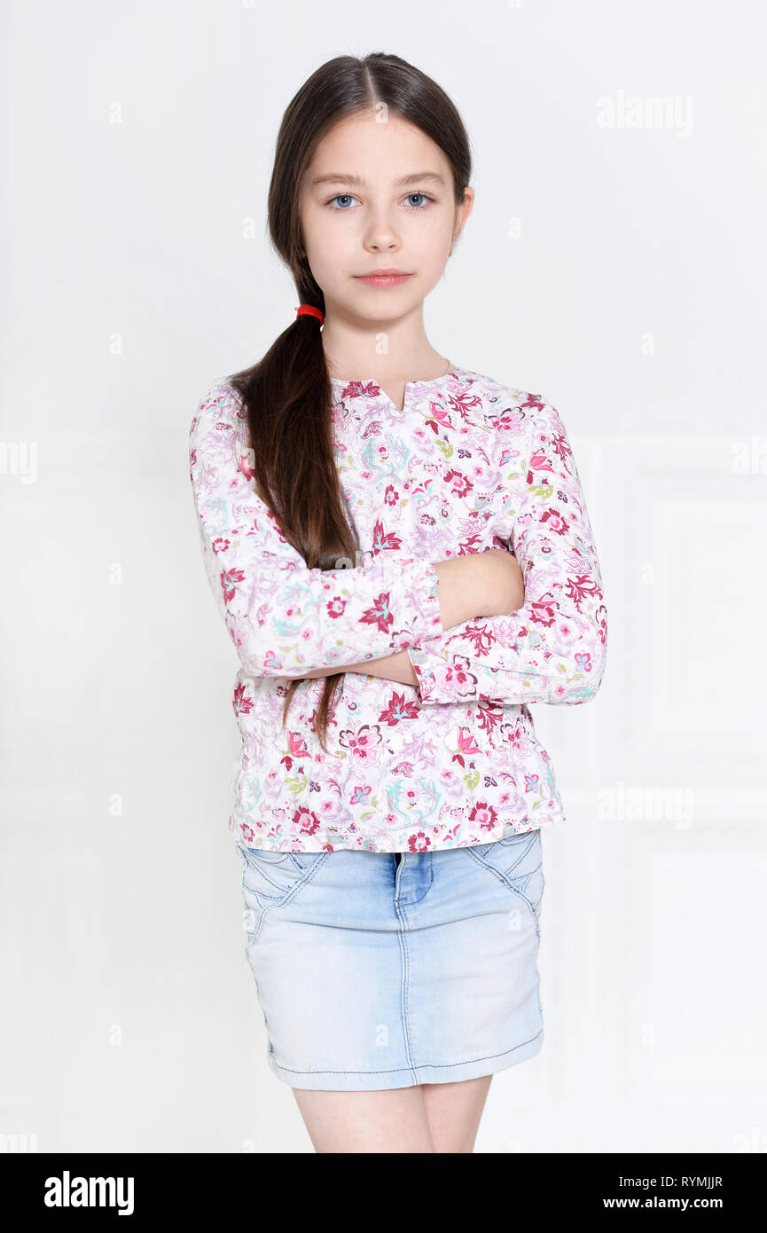 Portrait of cute little girl posing on white background Stock Photo - Alamy