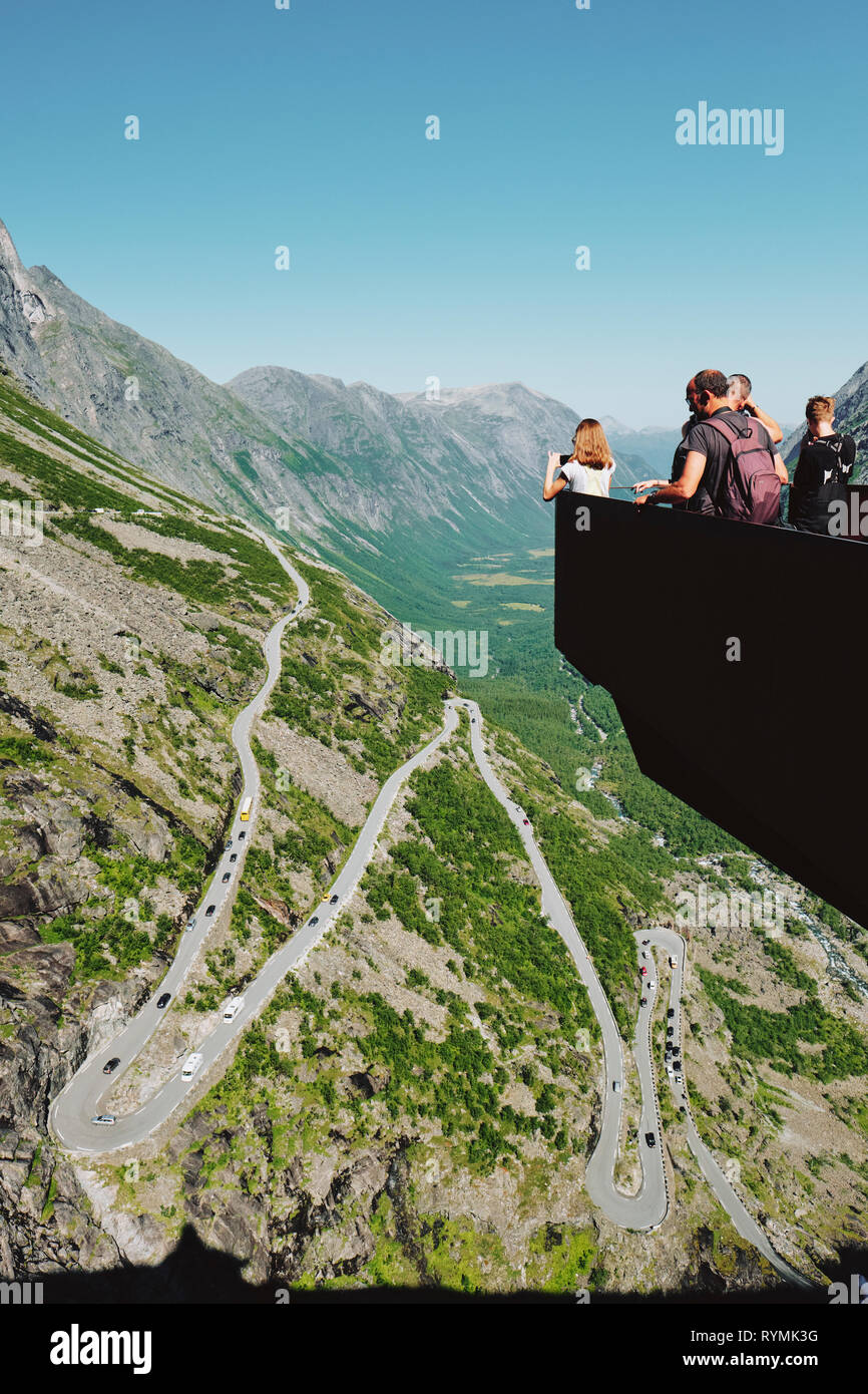 Tourists enjoying the Trollstigen viewpoint on the Geiranger-Trollstigen National Scenic Route in Norway - Architect: Reiulf Ramstad Arkitekter AS Stock Photo