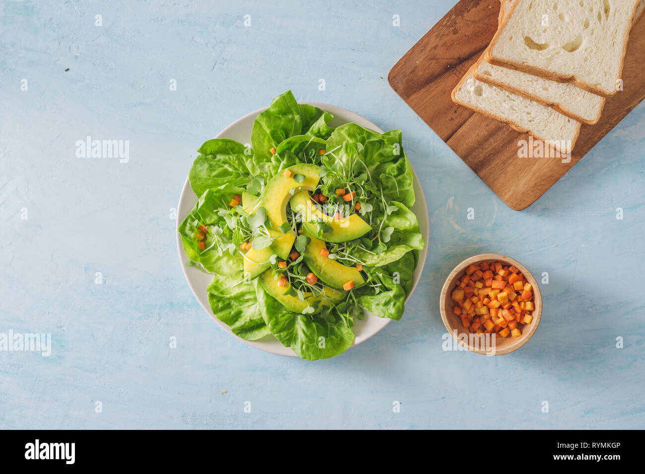Healthy green salad from avocado, cucumber, grapes, parsley and lettuce