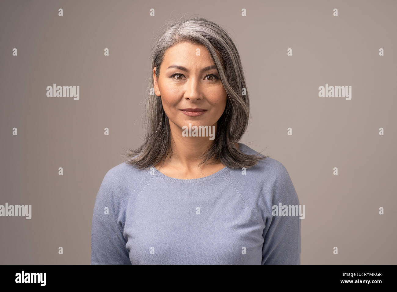 https://c8.alamy.com/comp/RYMKGR/beautiful-mongolian-woman-with-gray-hair-on-a-gray-background-RYMKGR.jpg