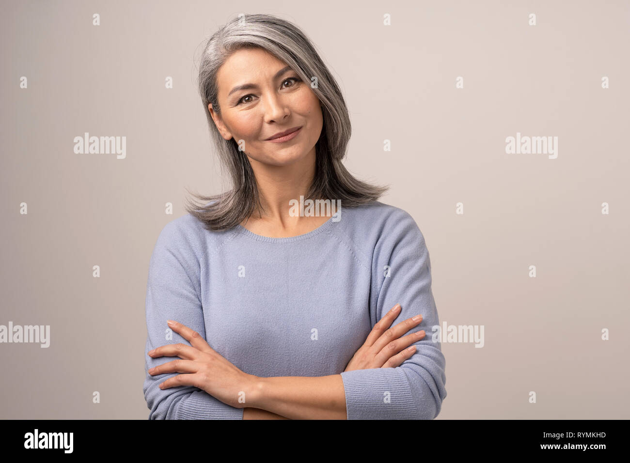 Beautiful Mongolian Woman With Gray Hair On A White
