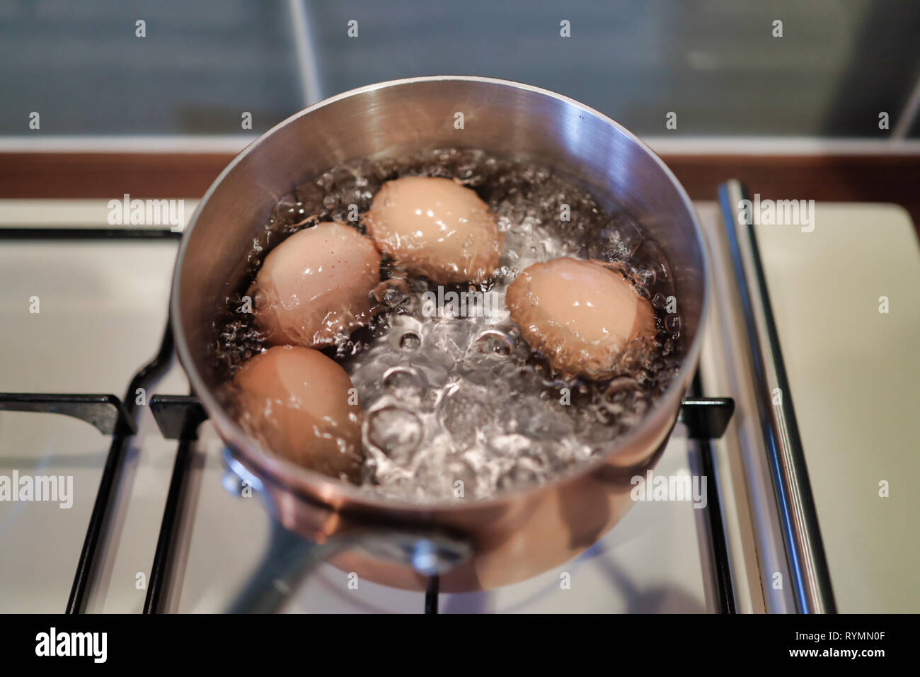 Boiling eggs for breakfast Stock Photo Alamy