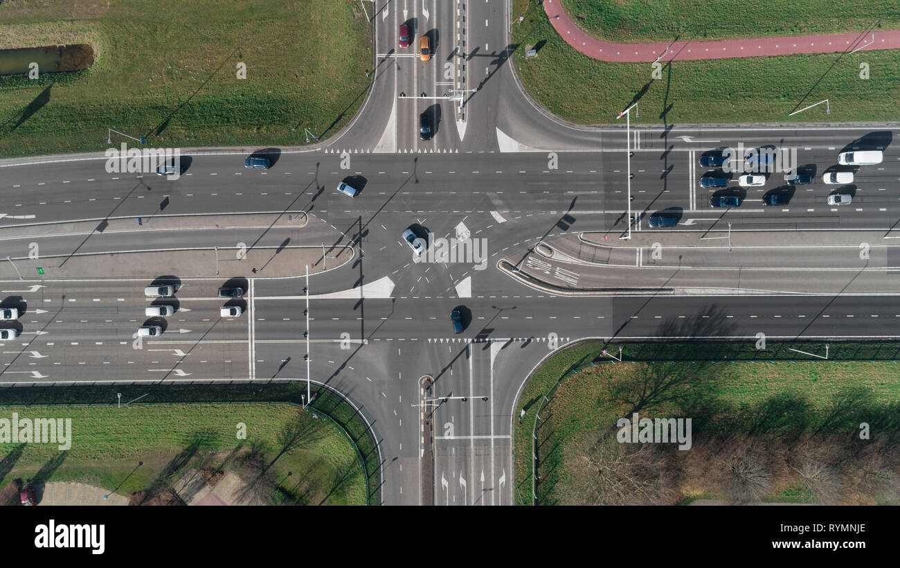 A Highway intersection with cars and traffic lights. Top view from