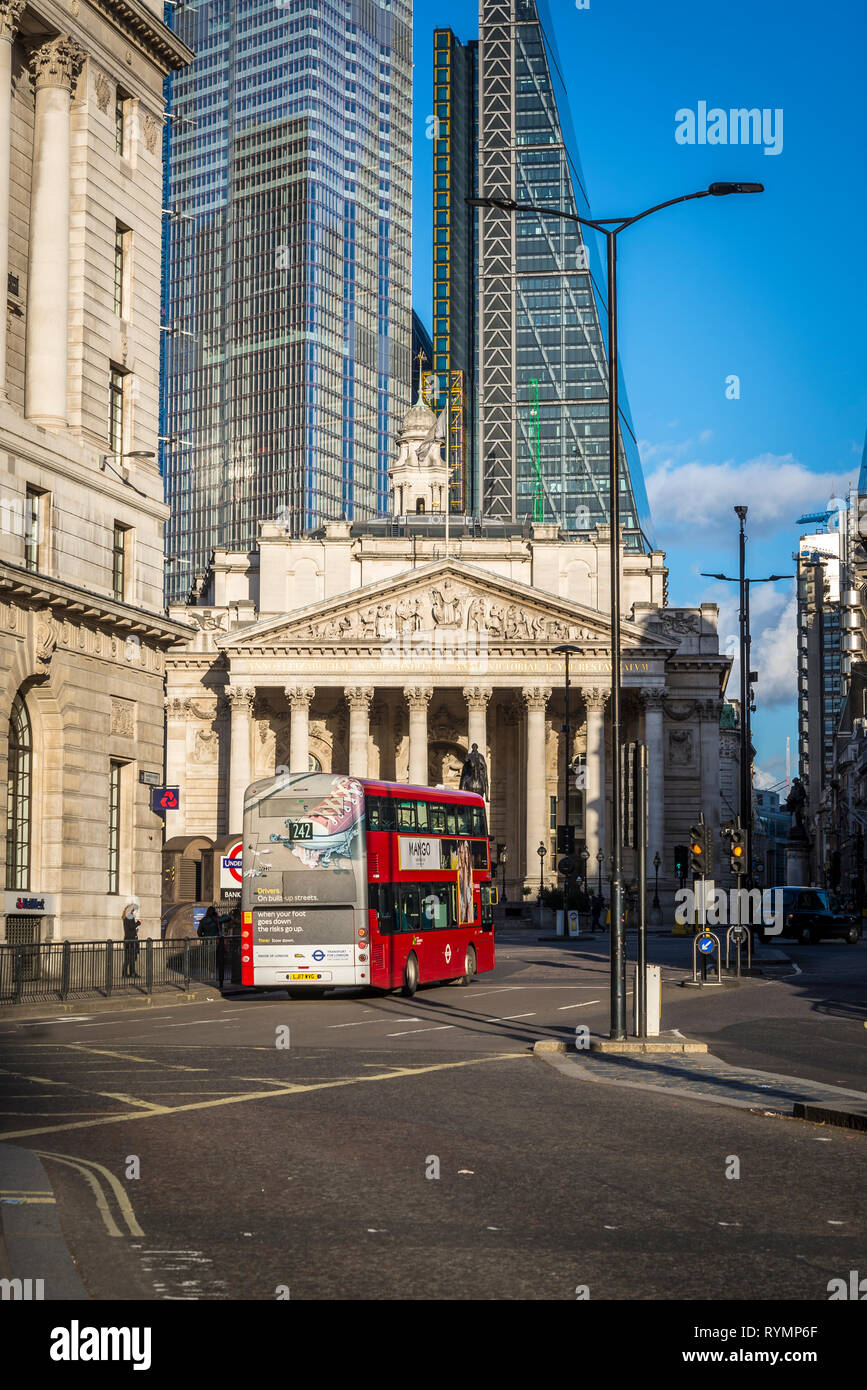 Bus passing by the Royal Exchange building, City of London, England, UK Stock Photo
