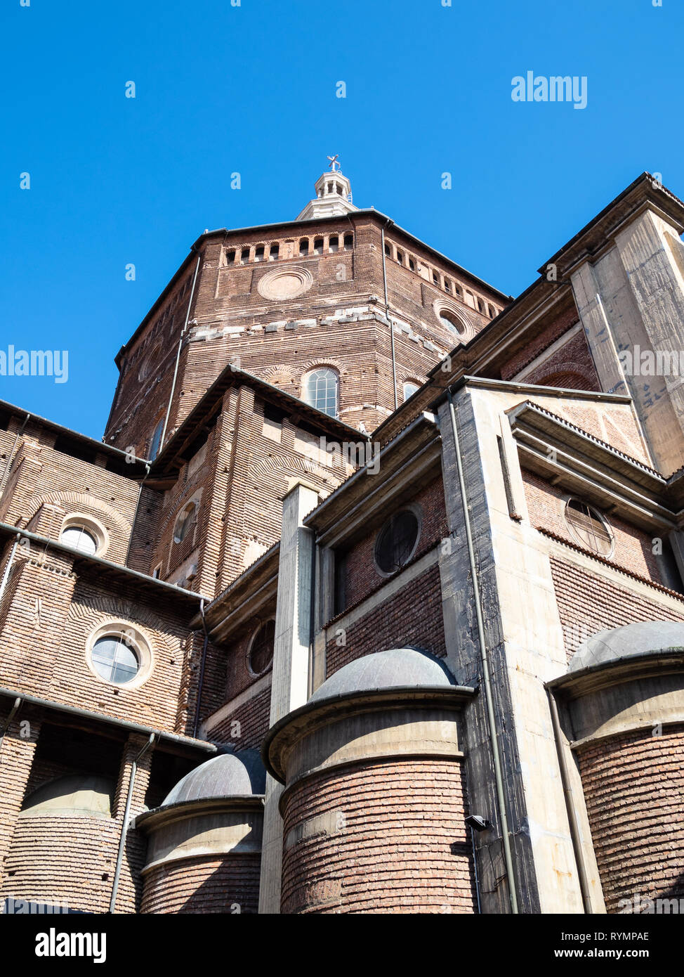 Travel to Italy - view of Duomo di Pavia (Cathedral of Pavia, Cattedrale di Santo Stefano Martire e Santa Maria Assunta) from street Via dei Liguri in Stock Photo
