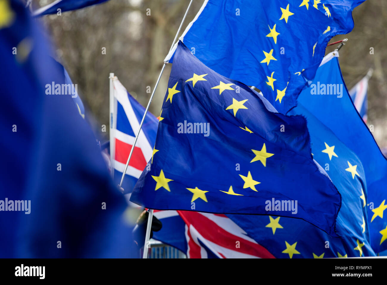Flags of the European Union flying at a brexit march in London Stock Photo