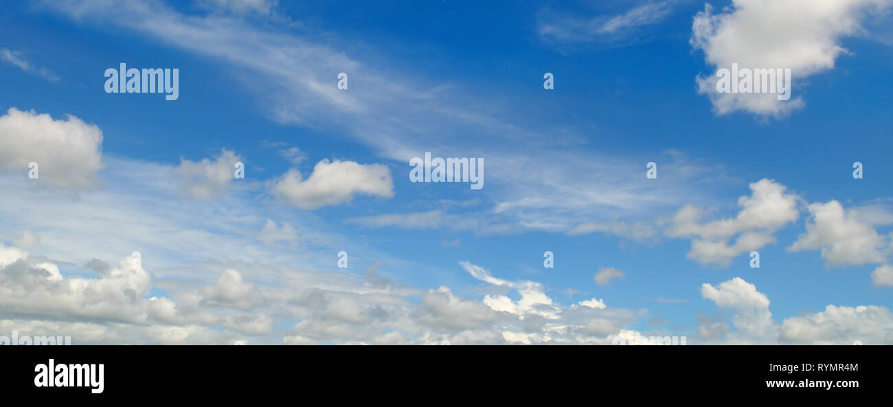 light cumulus clouds in the blue sky. wide image Stock Photo - Alamy