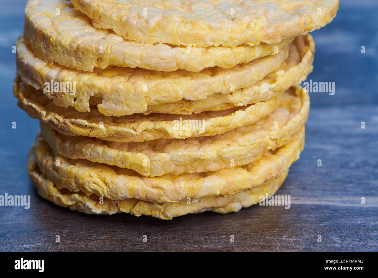 stack of corn wafers on a brown wooden surface Stock Photo
