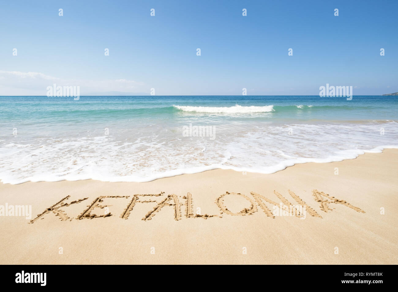 Kefalonia written in the sand from Trapezaki Beach looking out at the Ionian Sea in Kefalonia, Greece. Stock Photo