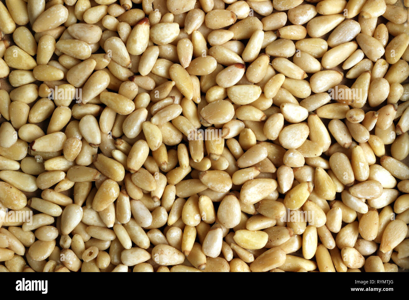 A close up of Pine nuts for background whole food texture Stock Photo